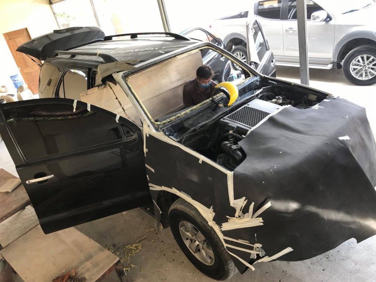 A vehicle part-way through the armoring process in the ARMADILLO workshop