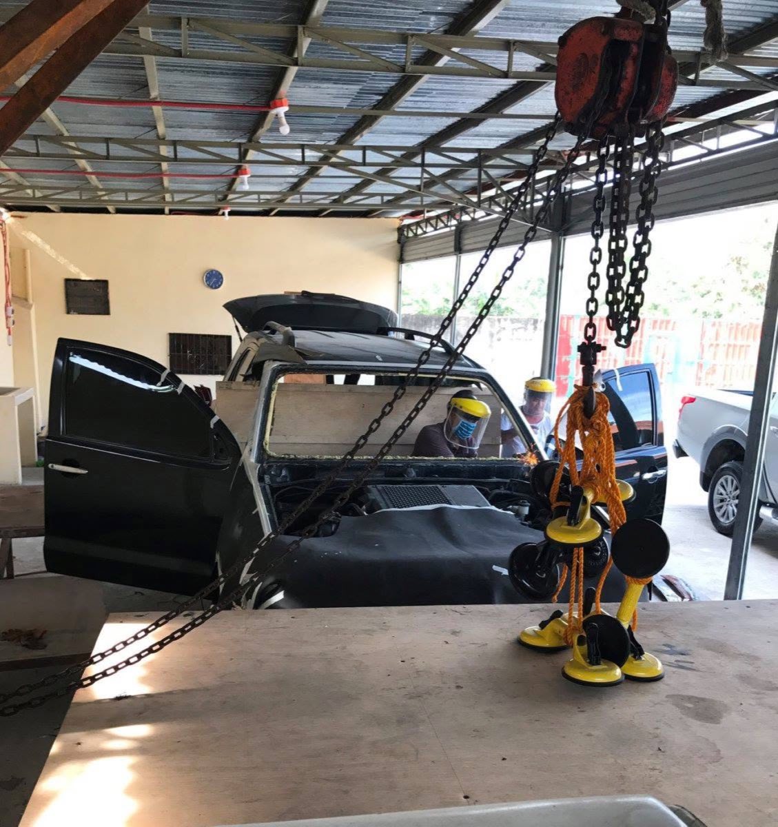 The ARMADILLO team working on a vehicle in the Cebu workshop